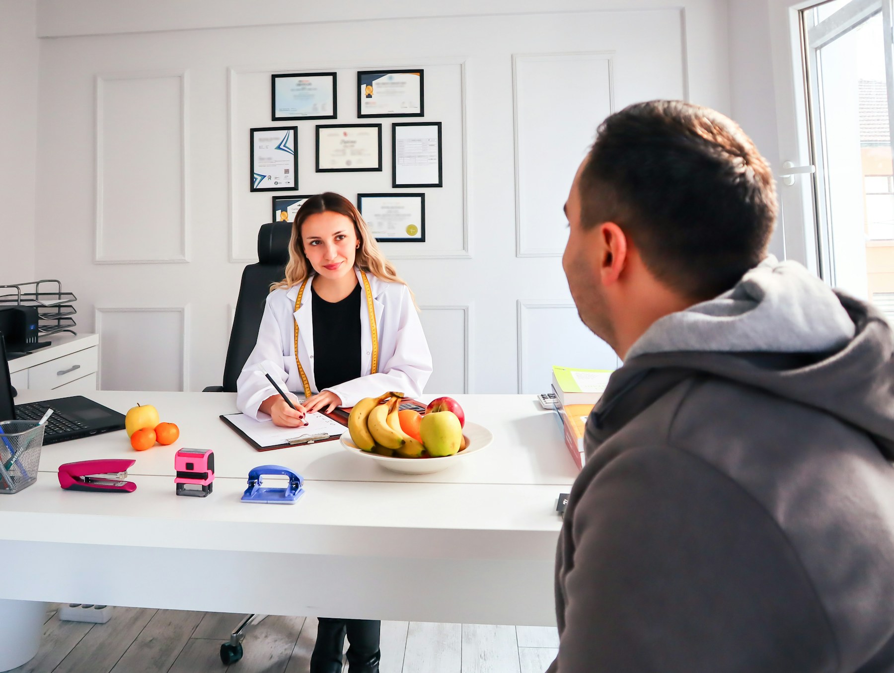 A participant having a planning conversation with a professional in an office
